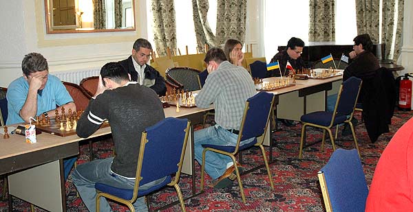 Seven of the eight leaders at the board: left to right: Yakovich, Roiz, Golod, Efimenko, 